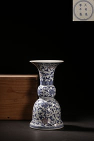 A Blue and White Flower Vase with Vine Patterns