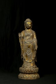 A Gilt Bronze Standing Buddha Statue
