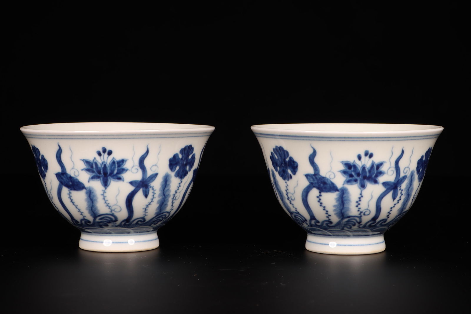 A Pair of Blue and White Cups: A Pair of Blue and White Cups. Dimensions: 3.25" x 2".