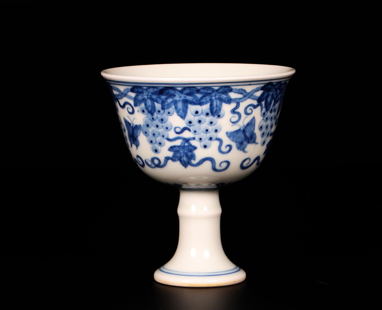 A Blue and White Stem Cup: A Blue and White Stem Cup. Dimensions: 3" x 3.2".