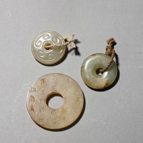A set of three jade ornaments