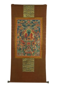 A TIBETAN THANGKA ON SILK FRAME