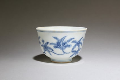 A Blue and White Cup with Flower Motif
