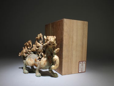 A Gold Pasted Bronze and Jade Mythical Beast