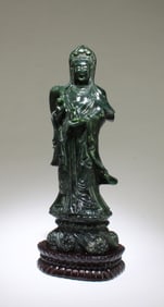 A Carved Spinach Jade Guanyin Statue