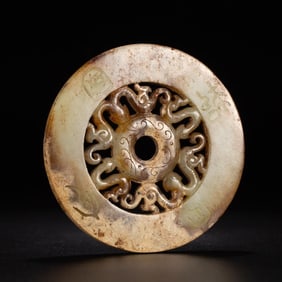 A CARVED JADE DISC BI