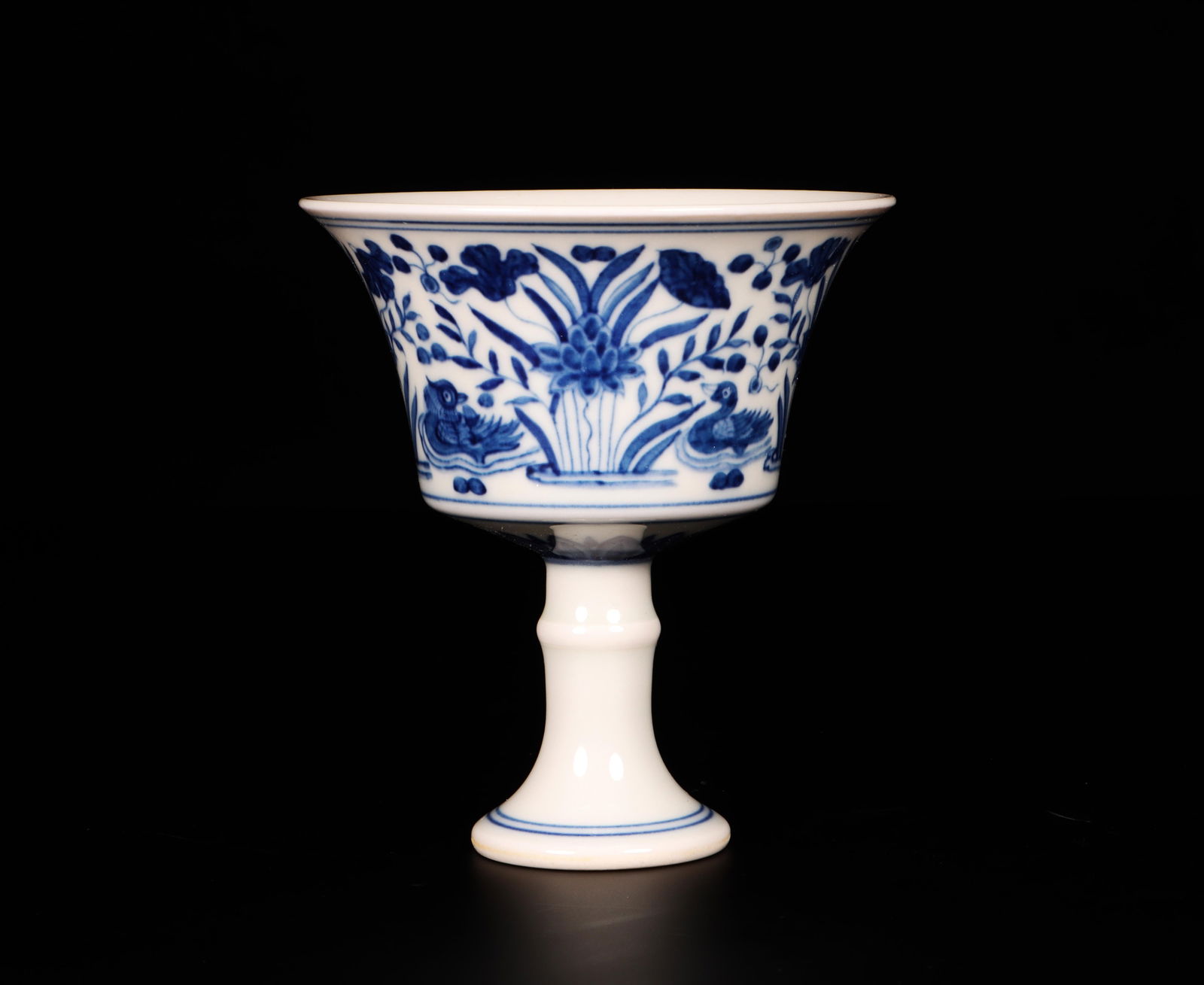 A Blue and White Stem Cup: A Blue and White Stem Cup. Dimensions: 3.2" x 3.5".
