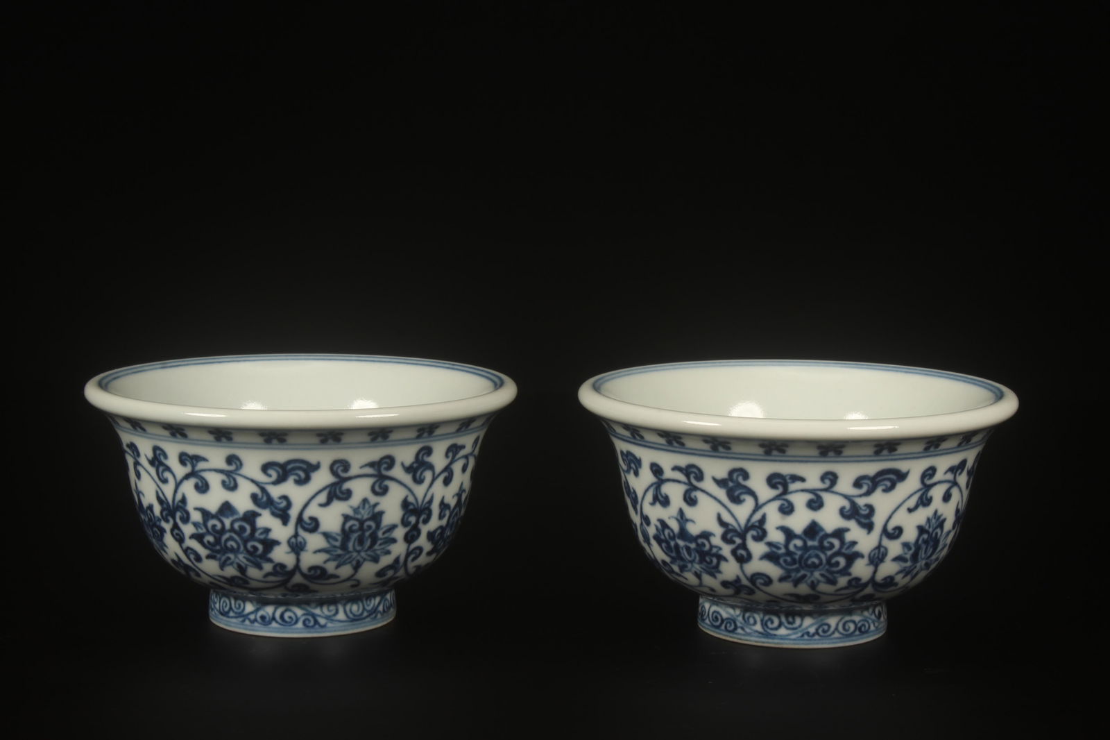A Pair of Blue and White Cups: A Pair of Blue and White Cups. Dimensions: 3.75" x 2".