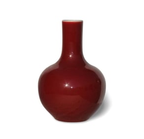 A Red Glazed Celestial Sphere Vase