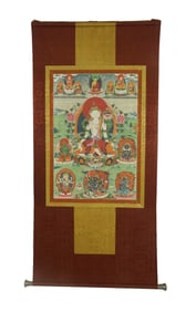 A TIBETAN THANGKA ON SILK FRAME