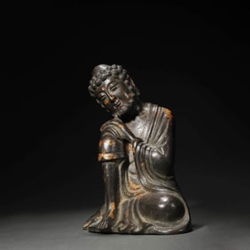 A Chinese Bronze Luohan Statue