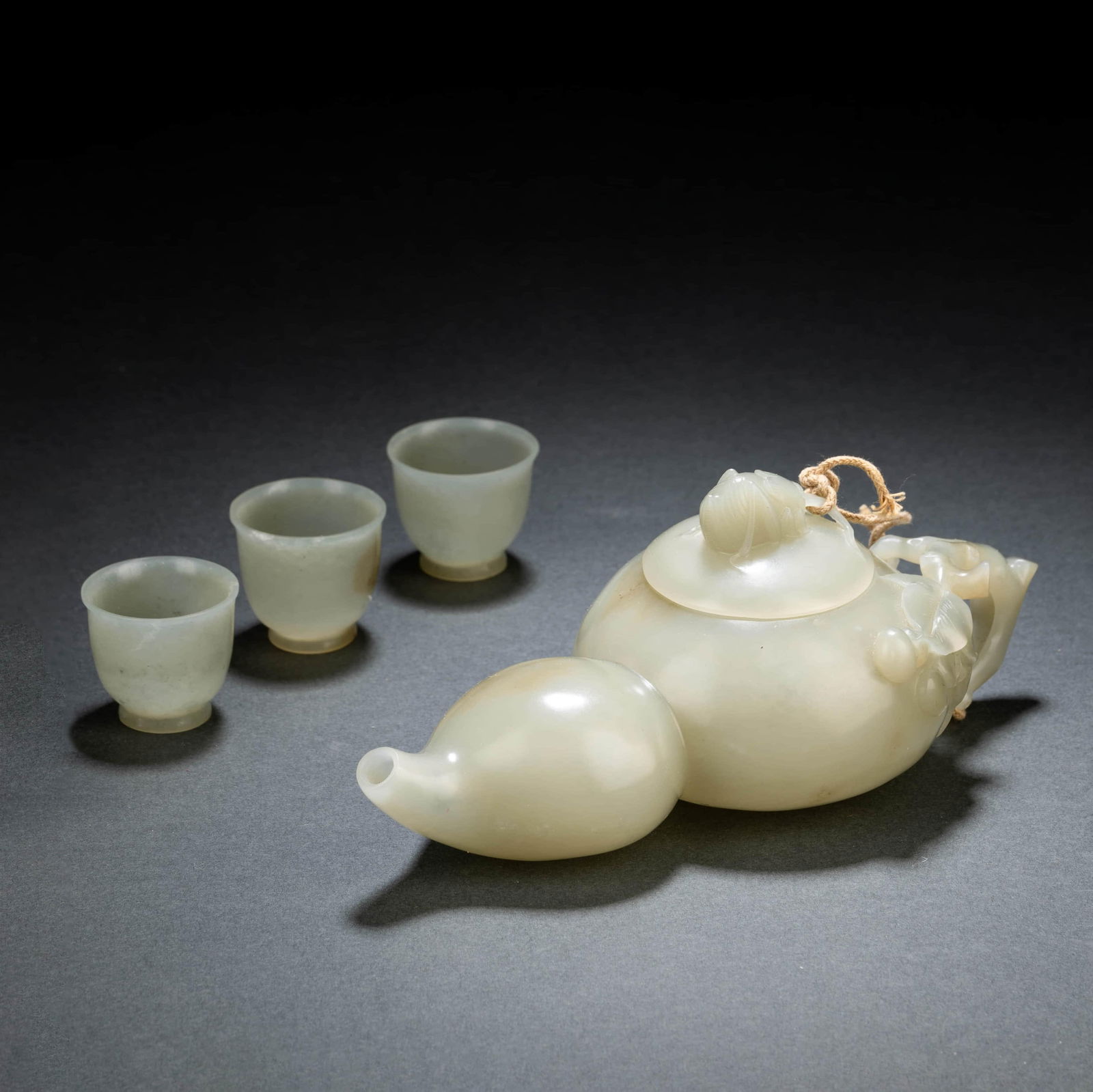 Sete Of Celadon Jade Tea Cups And Pot: Sete Of Celadon Jade Tea Cups And Pot. 1.Length:6.10", Width:2.83", Height:2.36" 2.Diam.1.22", Height:1.10"