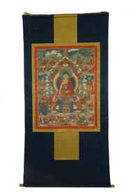 A TIBETAN THANGKA ON SILK FRAME