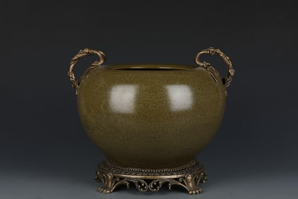 A Tea-Dust Glazed Porcelain Jar with Bronze Accent