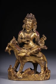 A Gilt Bronze Dharma Protector on Ram