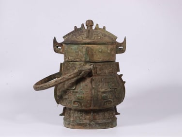 A Bronze Ritual Ewer with Taotie Mask