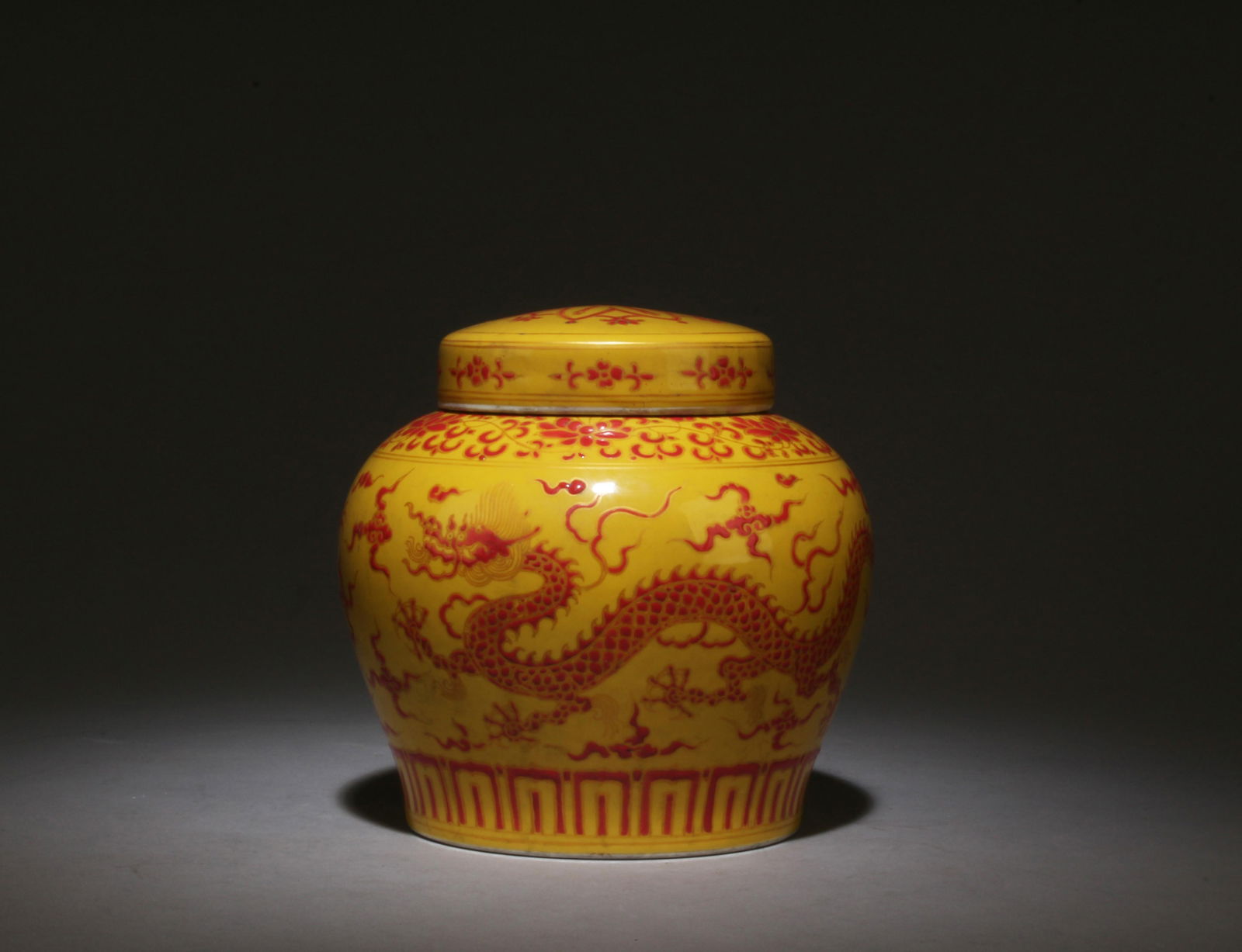 A Yellow and Red Jar with Lid: A Yellow and Red Jar with Lid. Dimensions: 5.5" x 6".