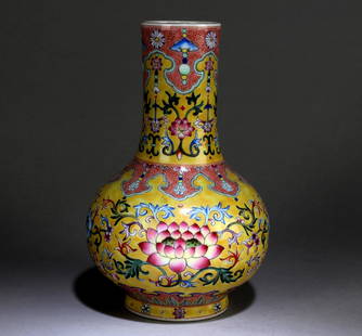 A Yellow-Ground Famille Rose Bottle Vase: A Yellow-Ground Famille Rose Bottle Vase. Dimension: 9" x 5.3".