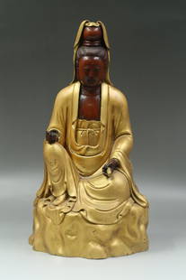 A Gold Lacquered Guanyin Statue Boxwood Carved: A Gold Lacquered Guanyin Statue Carved From Boxwood. Dimensions: 17" x 10"