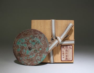 A Bronze Round Mirror