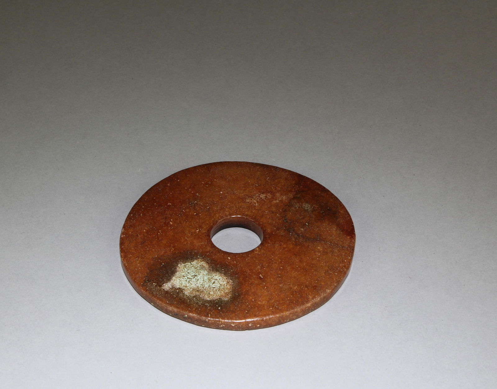 A Chinese Jade Bi: A Chinese Jade Bi. Diameter: 3.55"