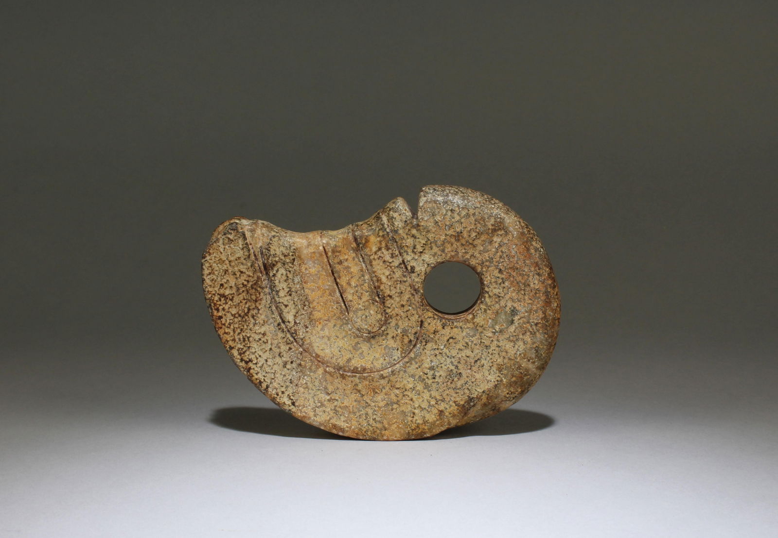 A Chinese Jade Ornament: A Chinese Jade Ornament. Dimensions: 6.1" X 4.25"