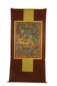A TIBETAN THANGKA ON SILK FRAME