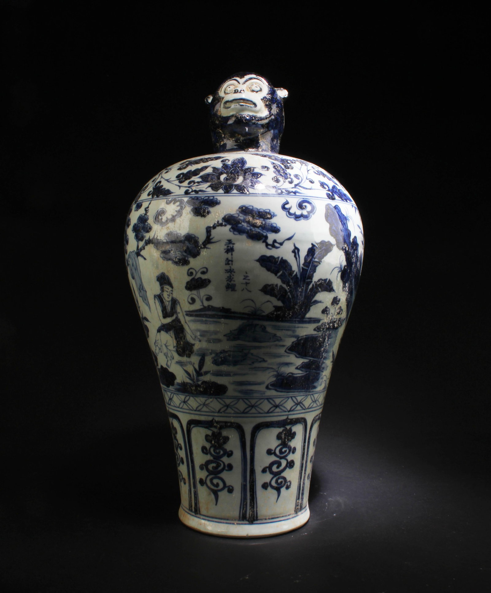 A Blue & White Porcelain Vase: A Blue & White Porcelain Vase, the top depicting a monkey shaped head. Height: 19.5"