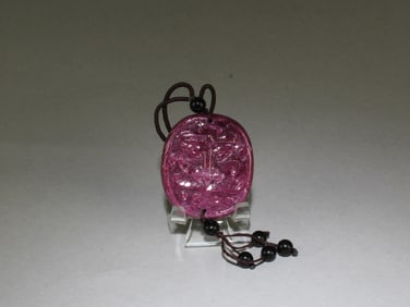 A Ruby Pendant with String