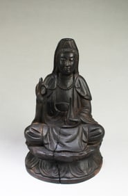 A Carved Wooden Seated Guanyin Statue