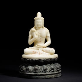 A Han White Jade Buddha Statue