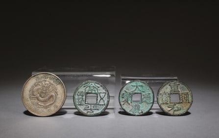 A Set of One Silver Coin and Three Bronze Coins