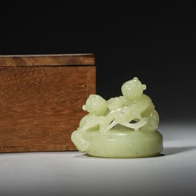 A Yellow Jade Ornament of a Child Beating Drum