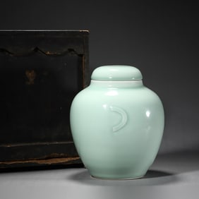 A Celadon Glazed Crescent Jar