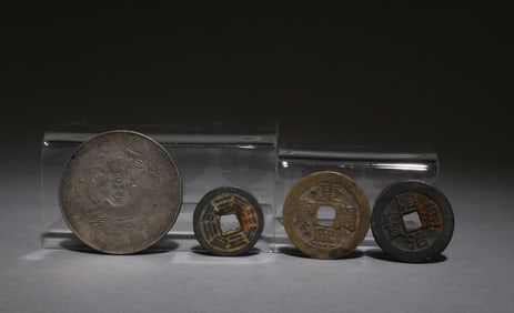 A Set of One Silver Coin and Three Bronze Coins