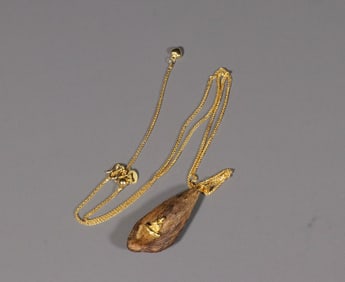 An Agarwood Pendant With 18k Gold Inlay