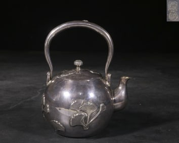 A Silver Teapot With Ginkgo Leaf Motif