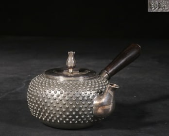 A Silver Side-Handle Teapot