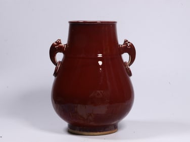 A Red Glazed Vase With Elephant Handles