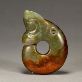 A CHINESE CARVED JADE PIG DRAGON