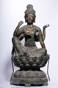 A Gilt Bronze Four-Armed Guanyin Statue with Floral Motif