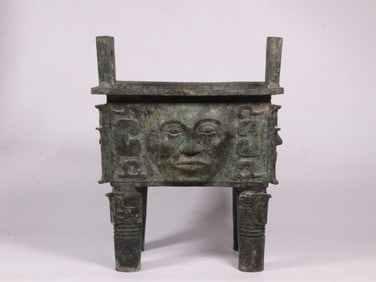 A Bronze Square Ding with Human Face Motif