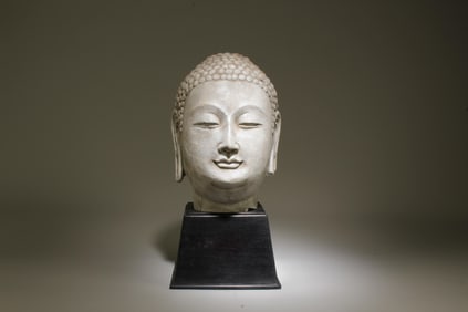 A Stone Buddha Head with Stand