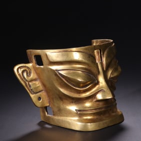 A Gilt Bronze Sanxingdui Mask