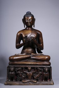 A Bronze Vairocana Buddha Statue with Silver Inlaid Eyes