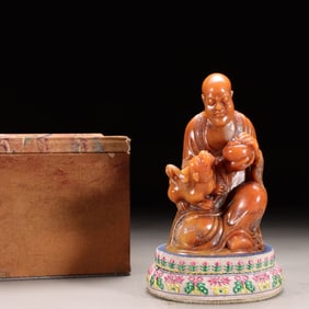 A Shoushan Chicken Blood Stone Arhat Statue