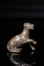 A Bronze Reclining Dog Ornament