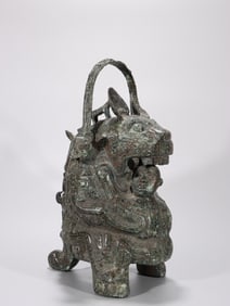 A Bronze Ornament of Tiger Devouring Man with Beast Motif