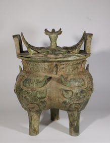 A Bronze Tripod Ding with Beast and Bull Head Motif