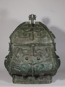 A Bronze Fangyi with Owl Motif